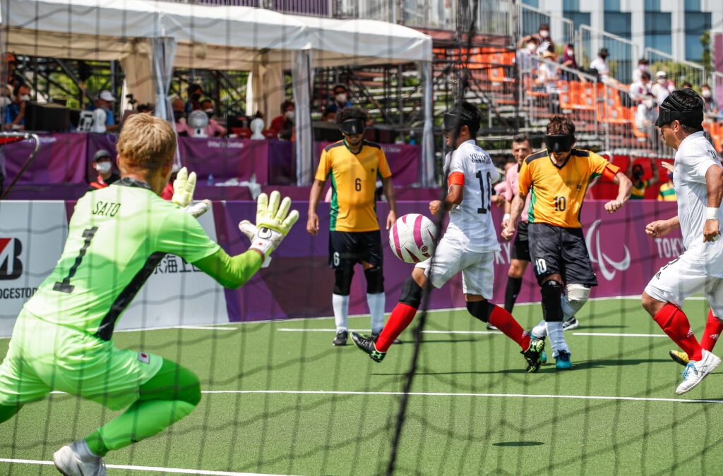 Brazil fire a shot towards the blind football goal in a match against Japan as the goalkeeper moves to make a save