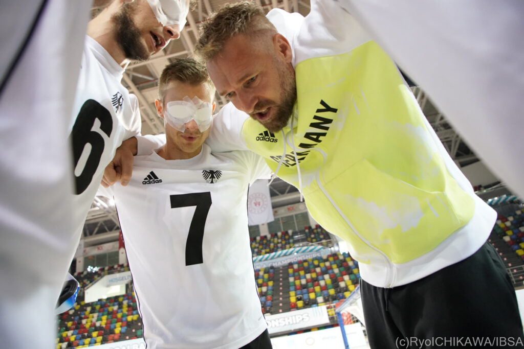 The German men's team gather for a group huddle